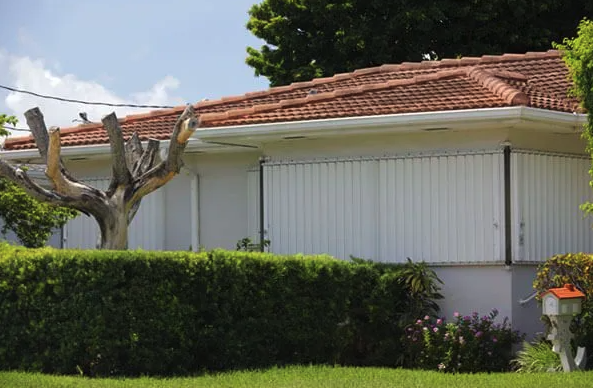 Hurricane panels installed over the windows of a Florida home